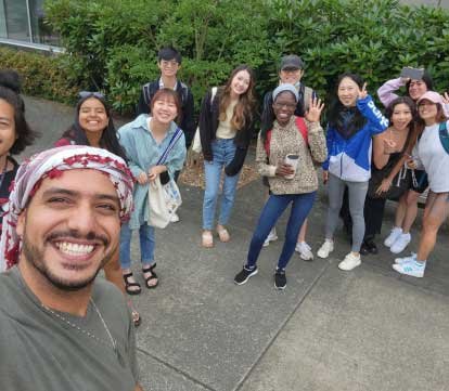 group of students takes a selfie on a field trip